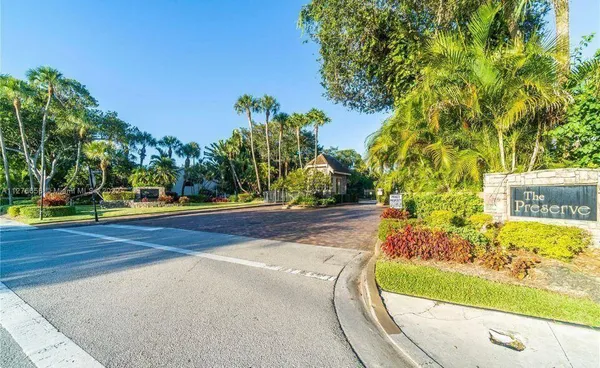 a view of a yard with yellow house