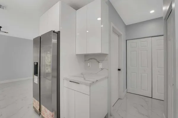 a bathroom with a shower and a sink