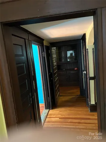 a view of hallway with stairs and a hallway