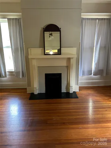 a view of fireplace and wooden floor