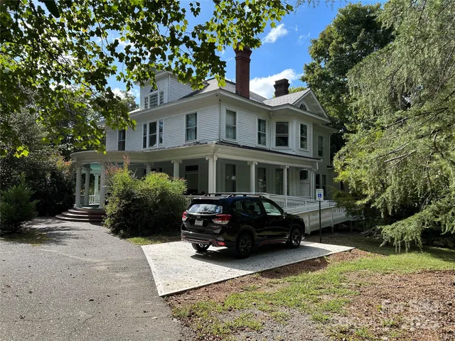 a car parked in front of a house