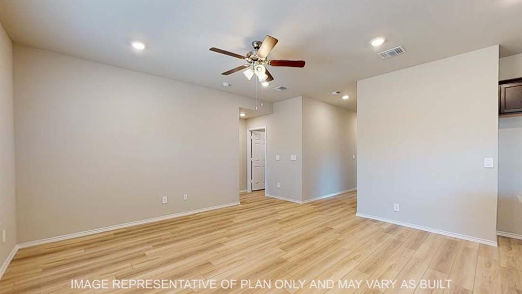 10429 Neptune Court Waco, TX 76708 - Photo 4 of 16 Wood-finish flooring throughout, recessed lighting, ceiling fan, neutral wall paint, and white trim