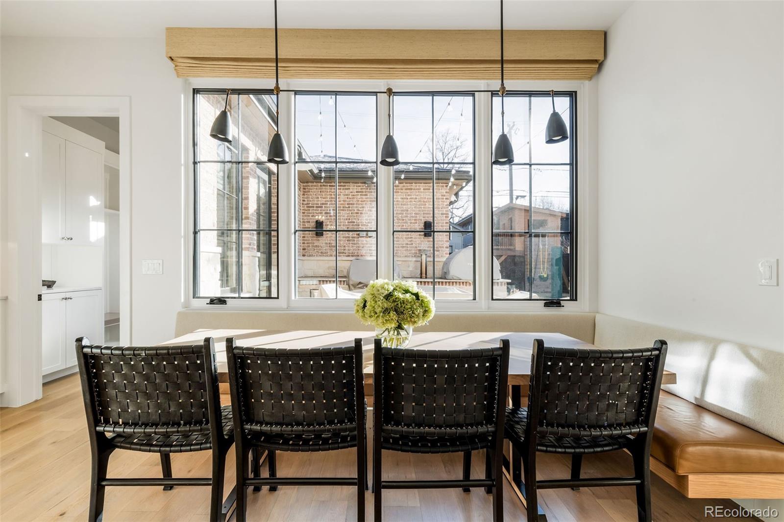 1026 South High Street Denver, CO 80209 - Photo 17 of 50 a dining room with furniture and window
