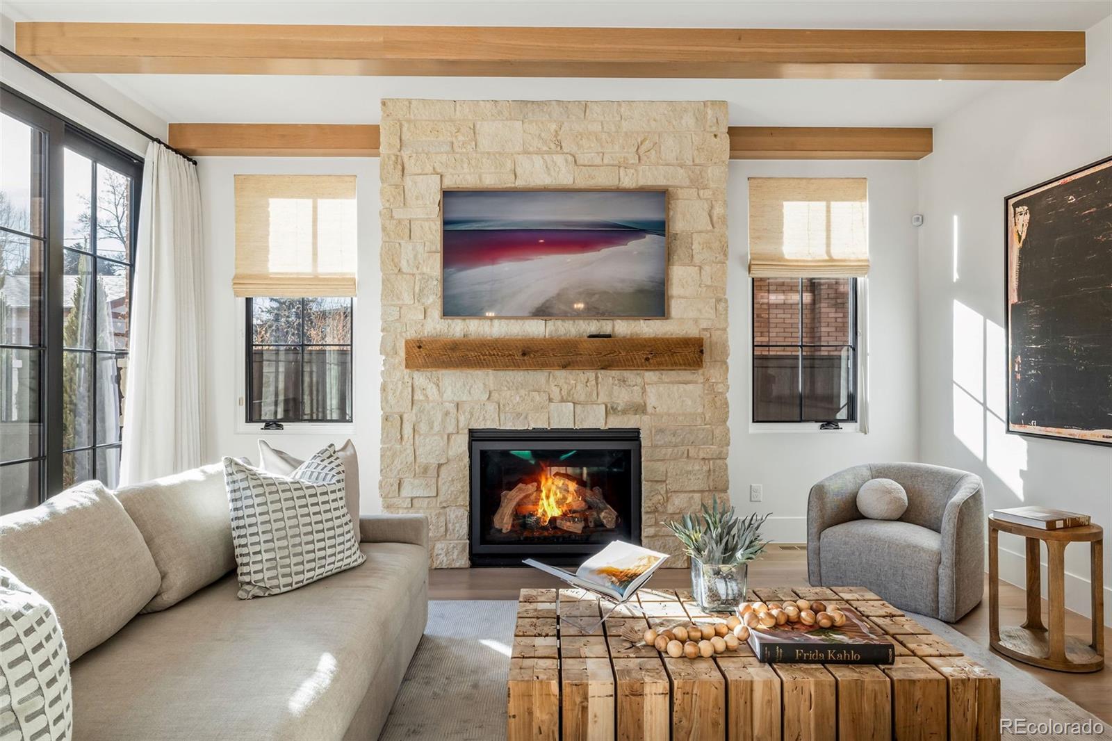 1026 South High Street Denver, CO 80209 - Photo 19 of 50 a living room with furniture and a fireplace