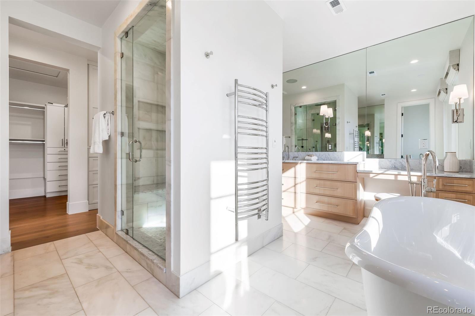 1026 South High Street Denver, CO 80209 - Photo 28 of 50 a bathroom with a tub shower and sink