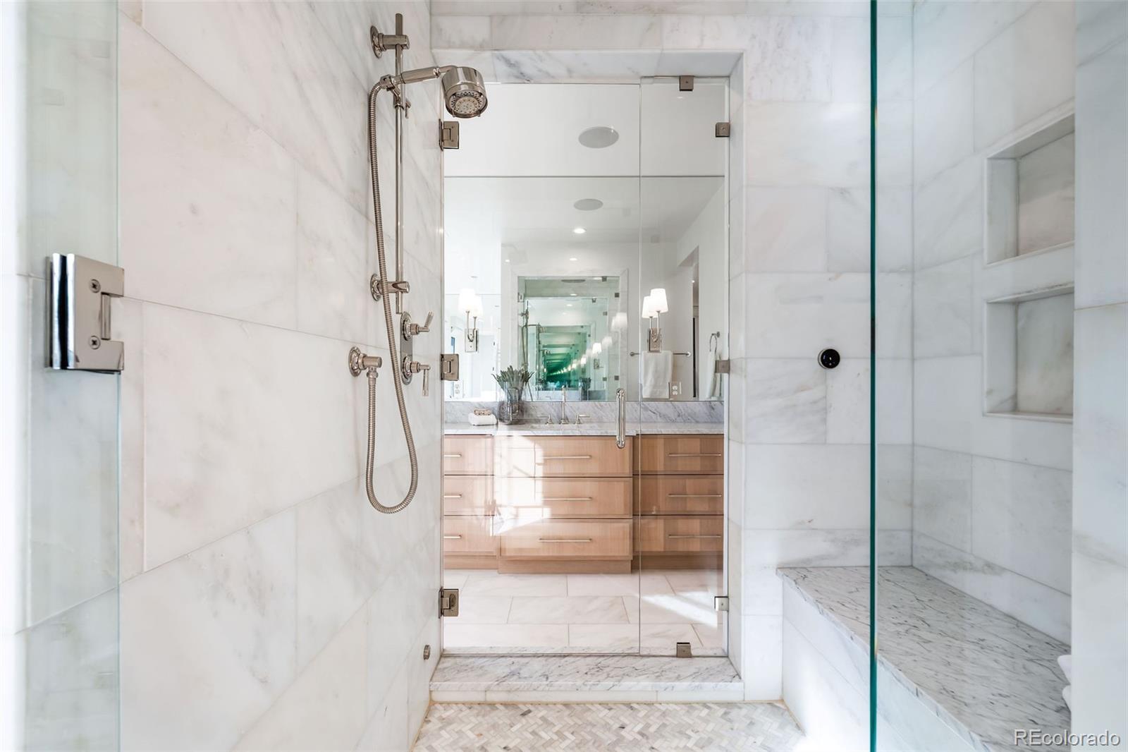 1026 South High Street Denver, CO 80209 - Photo 30 of 50 a bathroom with a glass shower door