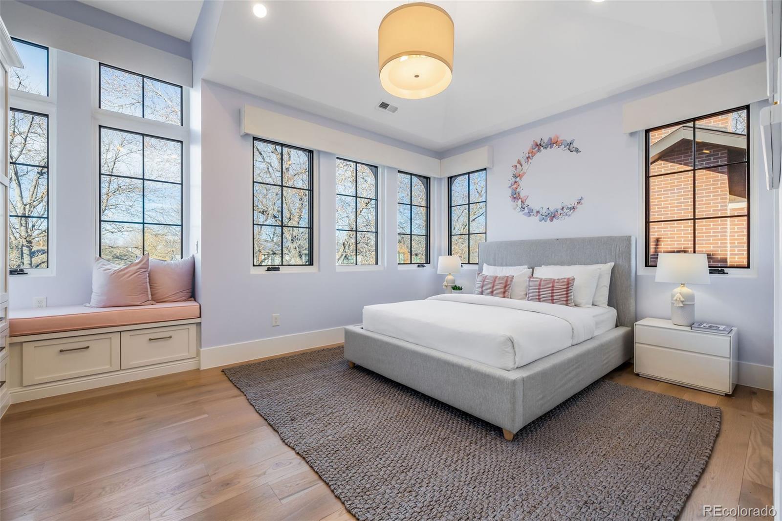 1026 South High Street Denver, CO 80209 - Photo 31 of 50 a spacious bedroom with a large bed and a window
