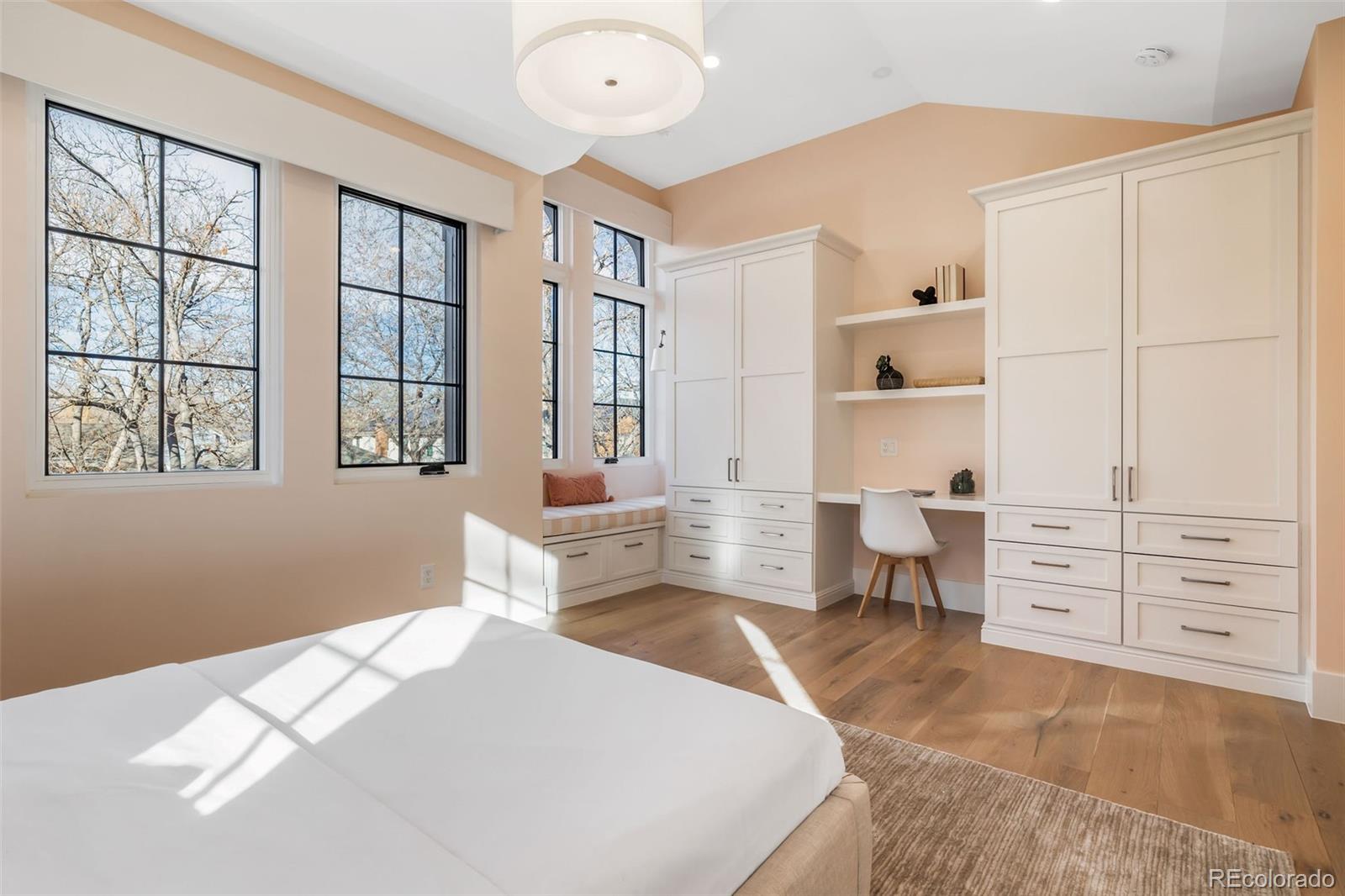 1026 South High Street Denver, CO 80209 - Photo 35 of 50 a bedroom with furniture and a window