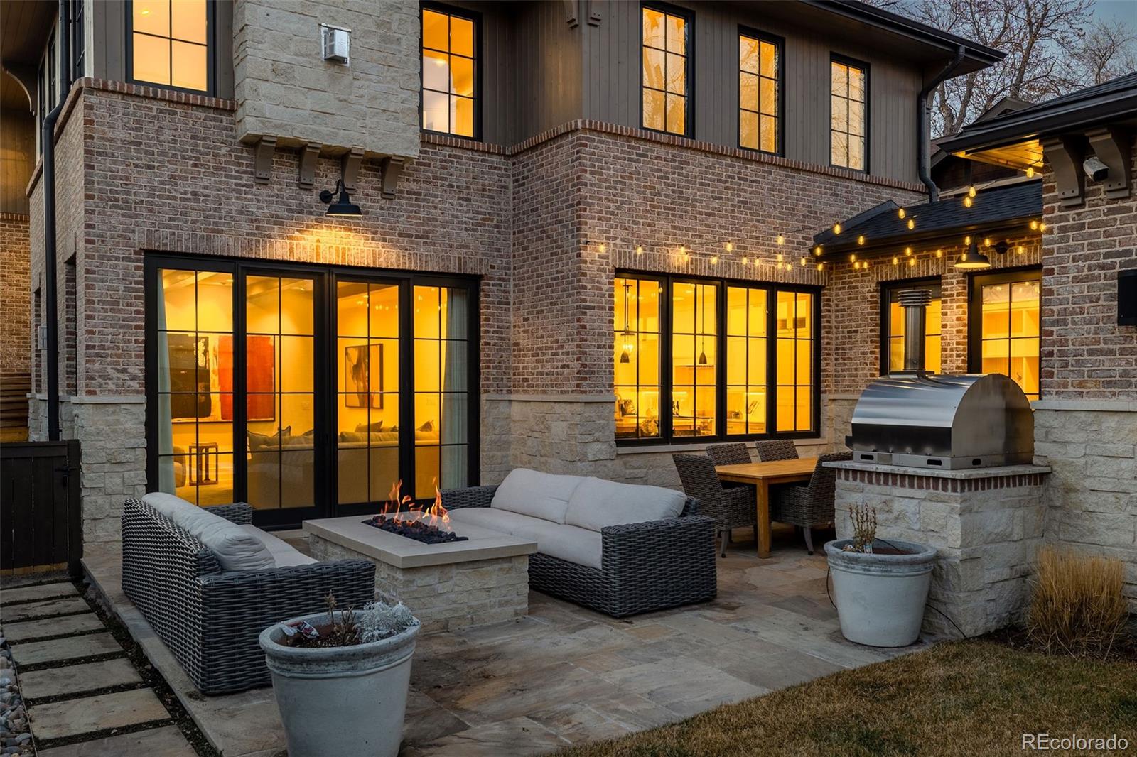 1026 South High Street Denver, CO 80209 - Photo 46 of 50 a outdoor living space with furniture and a fireplace