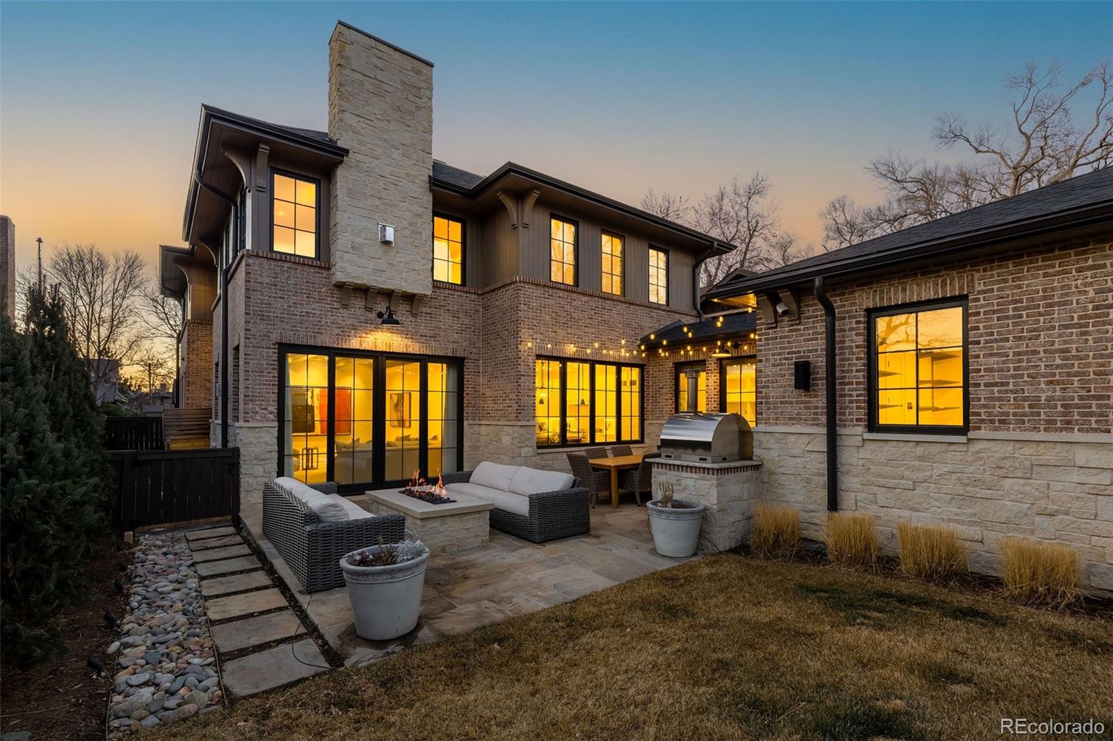 1026 South High Street Denver, CO 80209 - Photo 47 of 50 a view of a patio with couches chairs and a potted plant