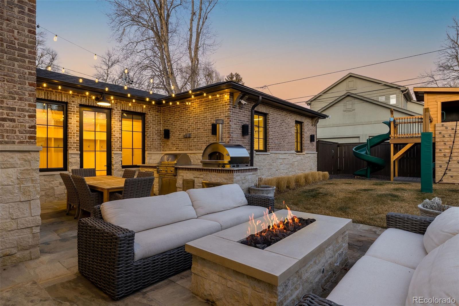 1026 South High Street Denver, CO 80209 - Photo 50 of 50 a living room with furniture and a fireplace