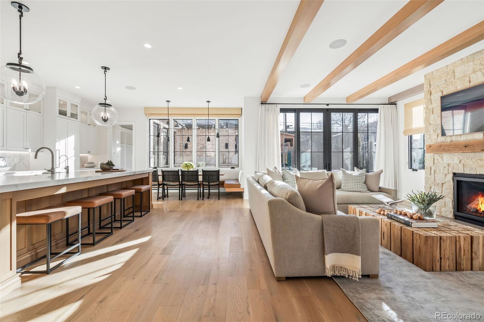 1026 South High Street Denver, CO 80209 - Photo 8 of 50 a living room with furniture and a fireplace