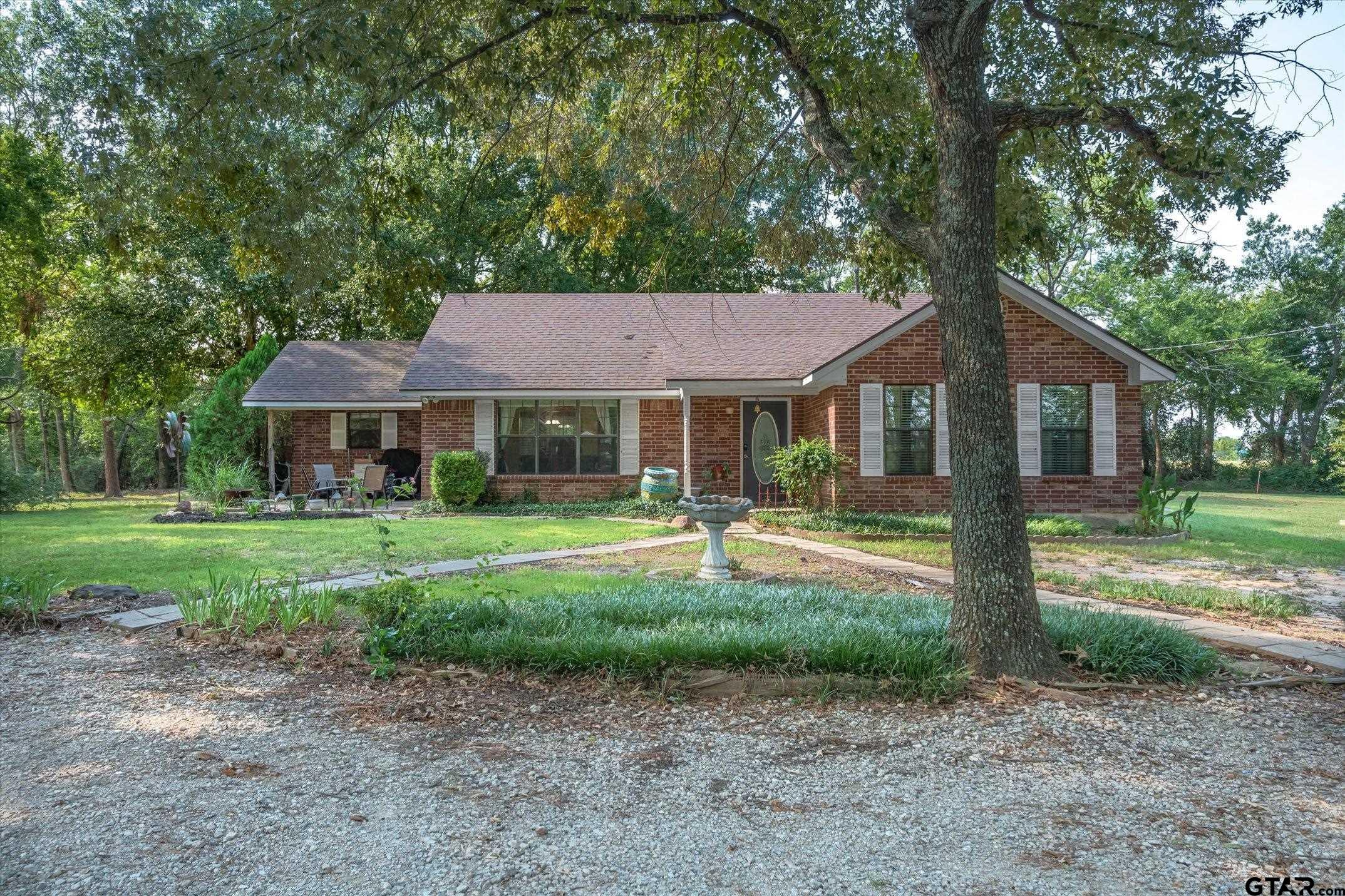 1200 Vz County Road Canton, TX 75103 - Photo 12 of 27 a front view of a house with a yard table and chairs
