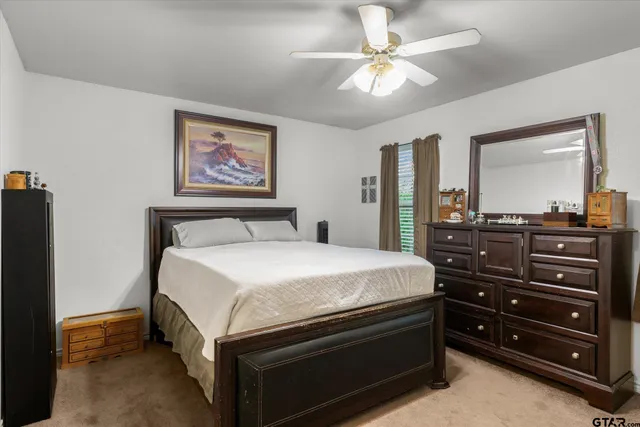 a bedroom with a bed and a dresser