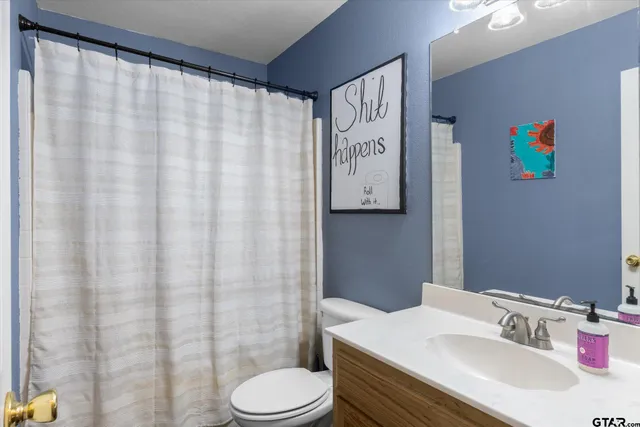 a bathroom with a sink and toilet