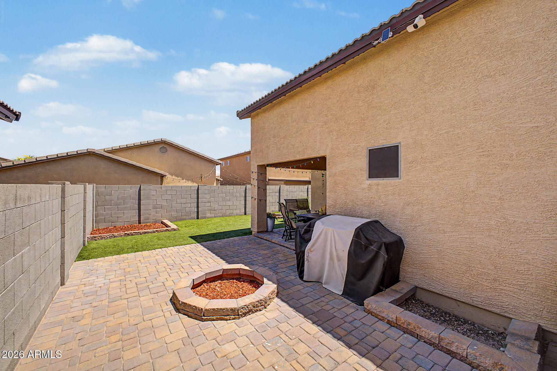 4924 West Harwell Road Laveen, AZ 85339 - Photo 27 of 27 a backyard of a house with barbeque oven table and chairs