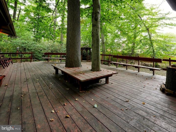 41 Robin Road Moorestown, NJ 08057 - Photo 18 of 23 a view of wooden deck with a table and chairs and wooden floor
