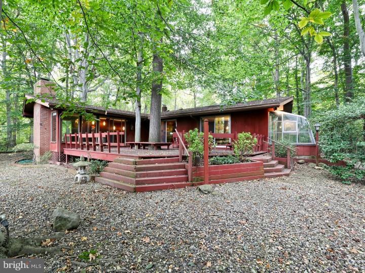 41 Robin Road Moorestown, NJ 08057 - Photo 19 of 23 a front view of a house with garden