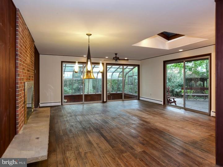 41 Robin Road Moorestown, NJ 08057 - Photo 3 of 23 an empty room with wooden floor and outdoor view