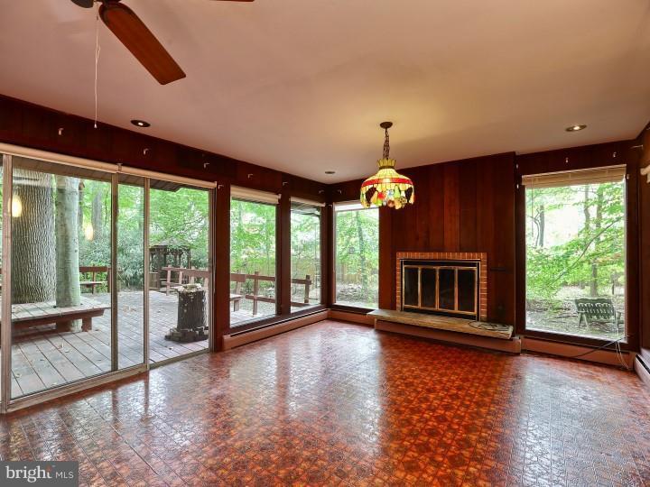 41 Robin Road Moorestown, NJ 08057 - Photo 8 of 23 a view of an empty room with wooden floor and a window
