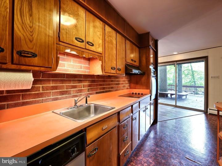 41 Robin Road Moorestown, NJ 08057 - Photo 10 of 23 a kitchen with stainless steel appliances a sink and cabinets