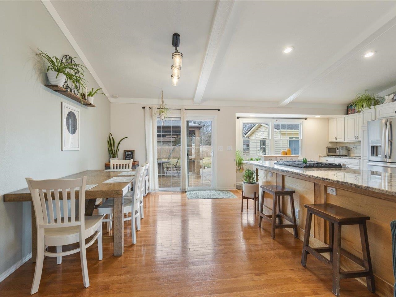 11818 Balsa Lane Roscoe, IL 61073 - Photo 11 of 44 a view of a dining room with furniture and wooden floor