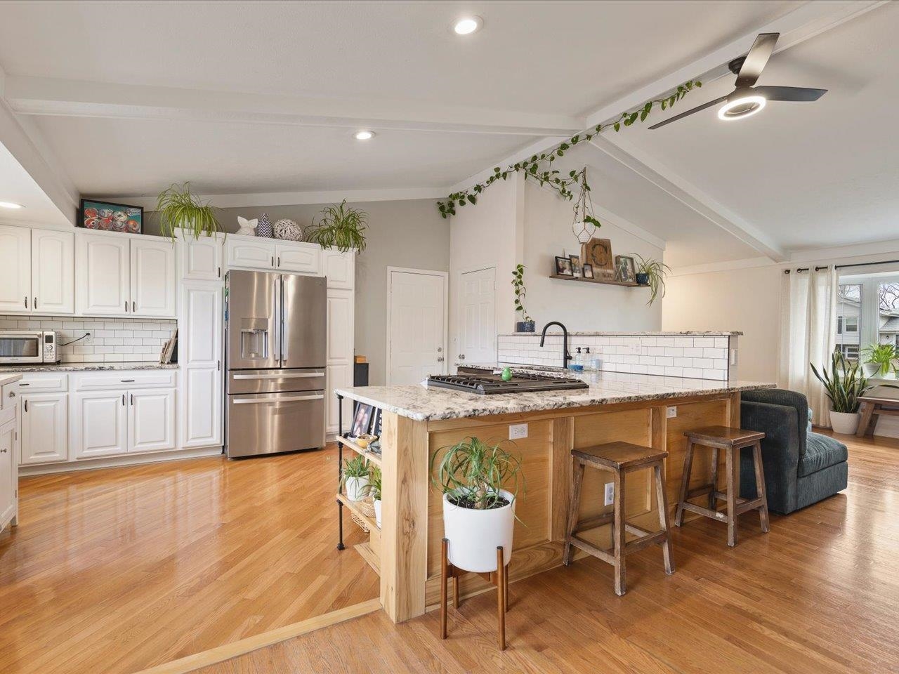 11818 Balsa Lane Roscoe, IL 61073 - Photo 13 of 44 a kitchen with stainless steel appliances a table chairs refrigerator and cabinets