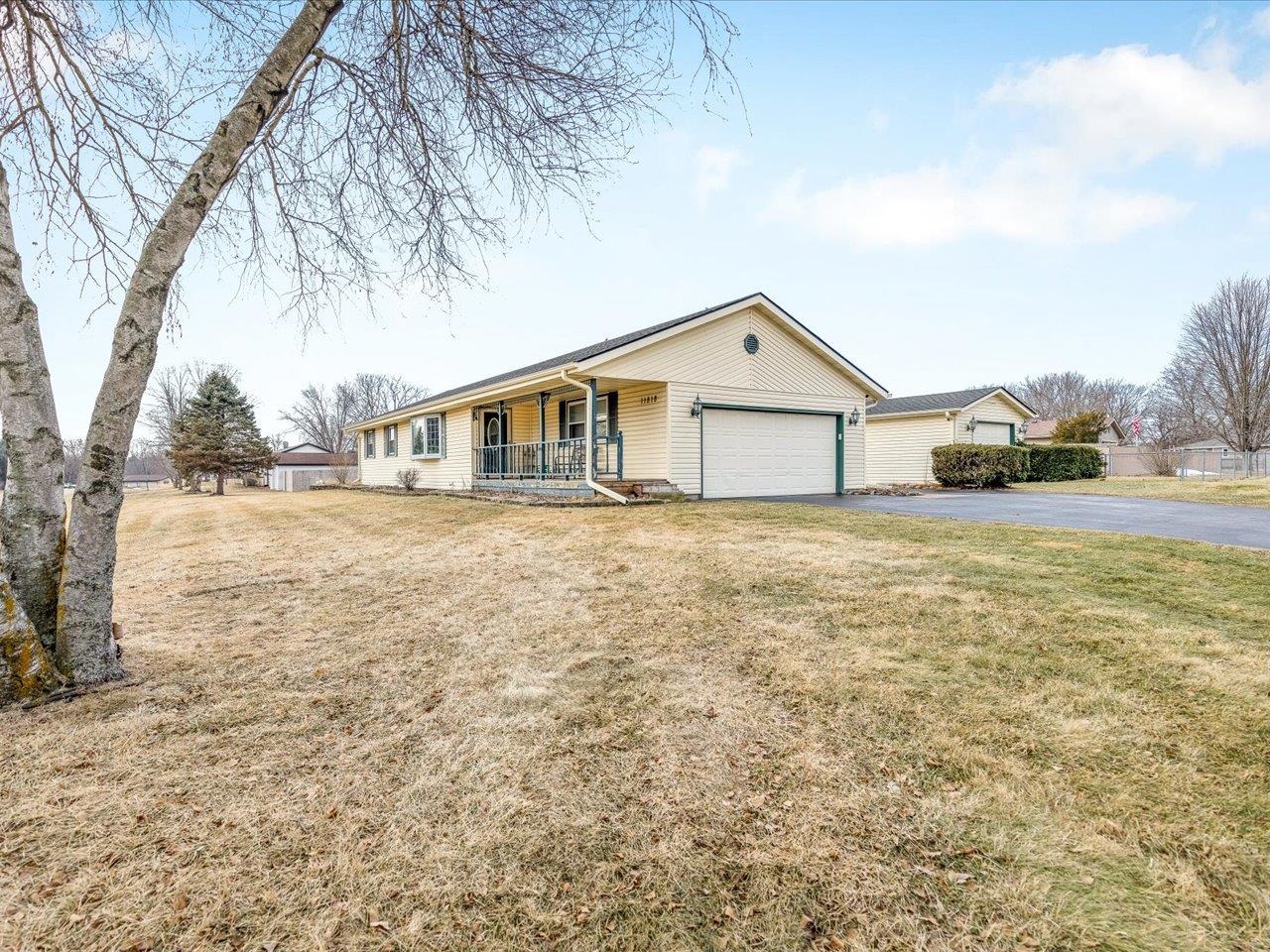 11818 Balsa Lane Roscoe, IL 61073 - Photo 4 of 44 a view of a house with a big yard and large trees
