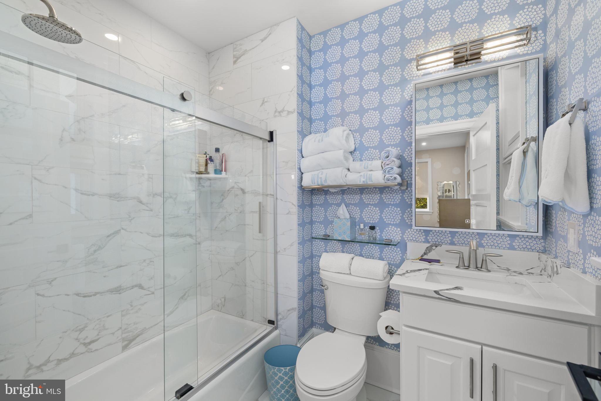 1305 30th Street Northwest, Unit 106 Washington, DC 20007 - Photo 11 of 14 a bathroom with a sink toilet and shower