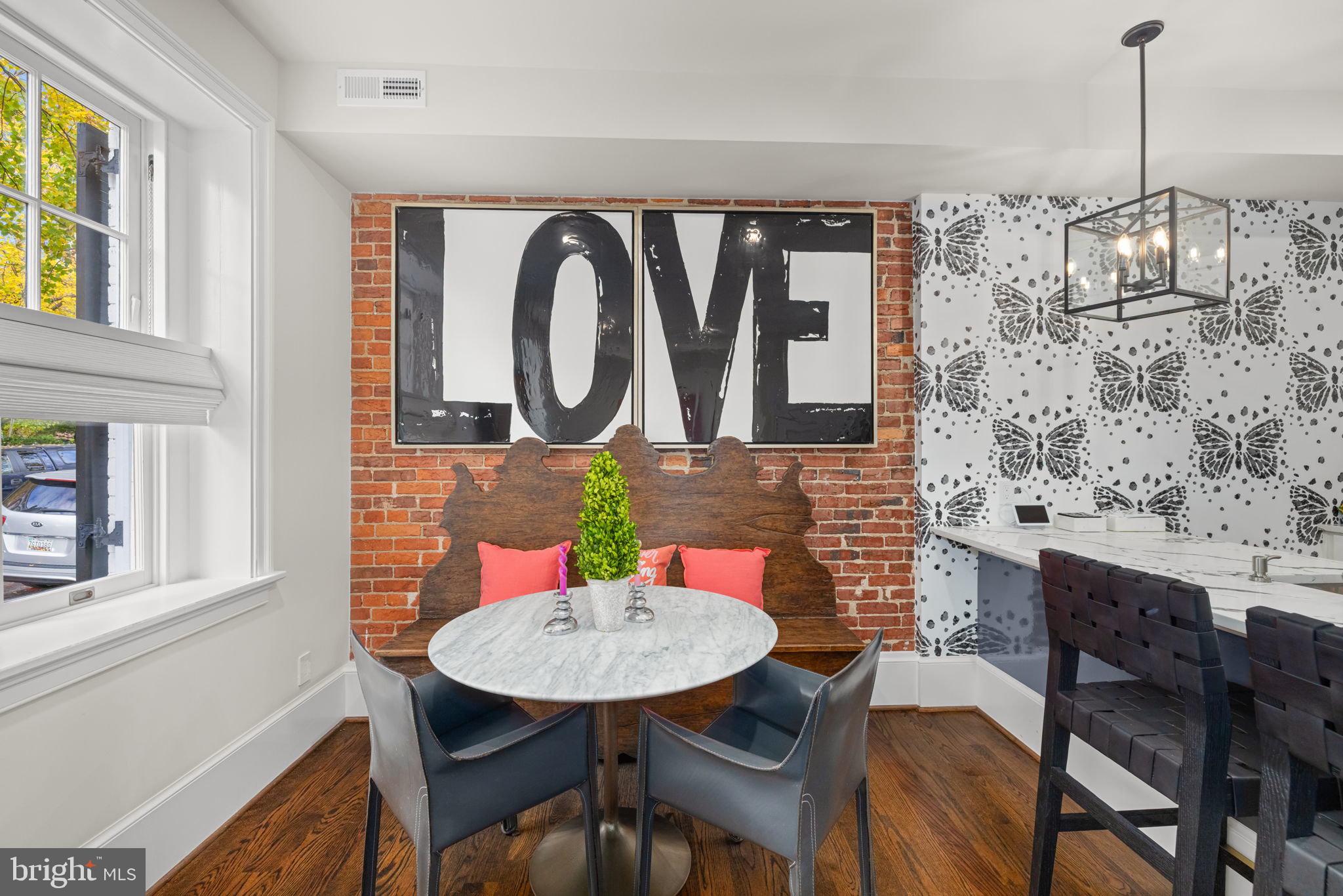 1305 30th Street Northwest, Unit 106 Washington, DC 20007 - Photo 3 of 14 a view of a dining room with furniture and wooden floor