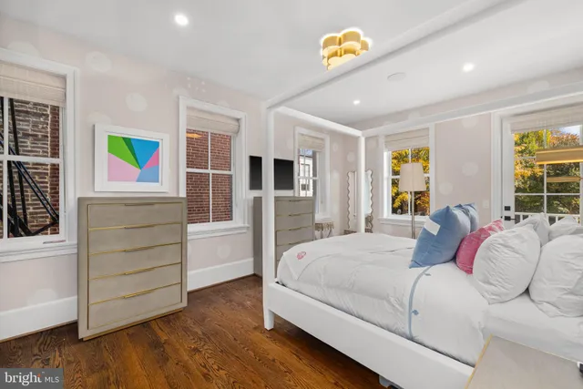 a bedroom with a bed and a couch