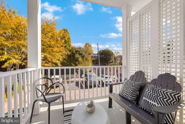 a view of a balcony with furniture