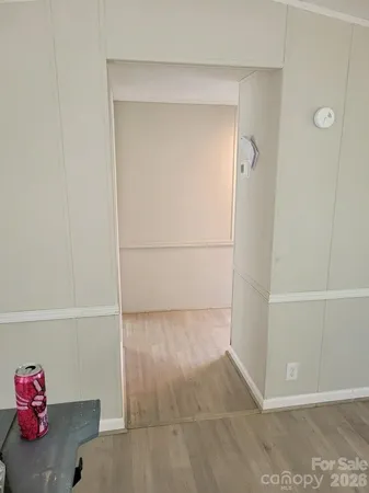 a view of a house with backyard and wooden fence