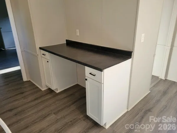 a kitchen with a stove and a refrigerator