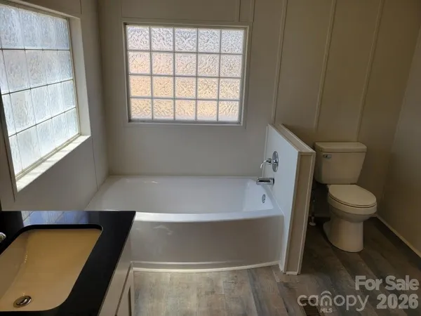 a view of a kitchen from a hallway