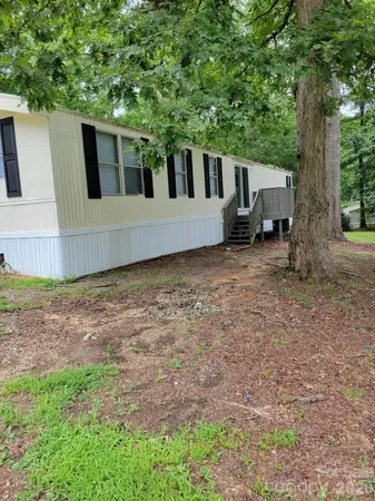 a house view with a backyard space