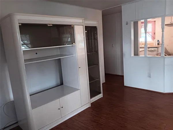 a kitchen with a refrigerator and window