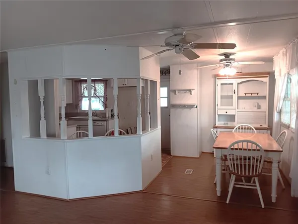 a kitchen with stainless steel appliances kitchen island granite countertop a refrigerator and a stove top oven