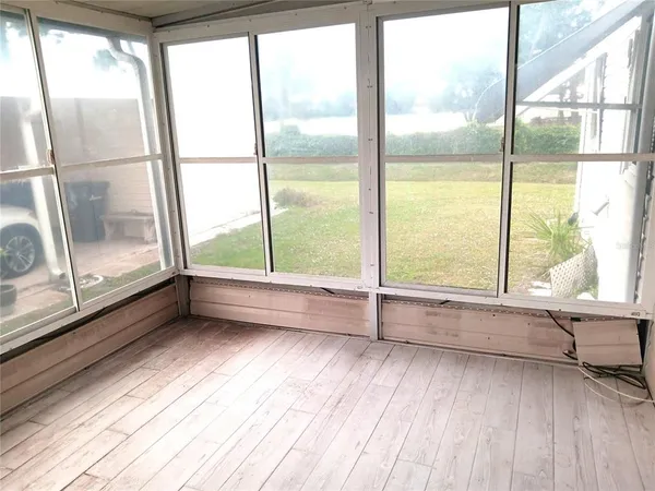 an empty room with wooden floor