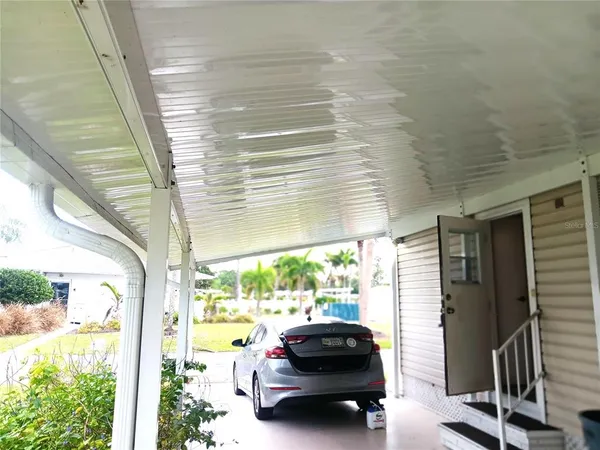 a living room with furniture wooden floor and a table