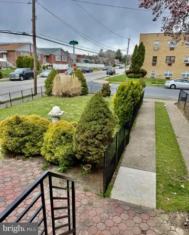 a view of a backyard with sitting area