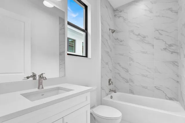 a bathroom with a sink toilet and bathtub