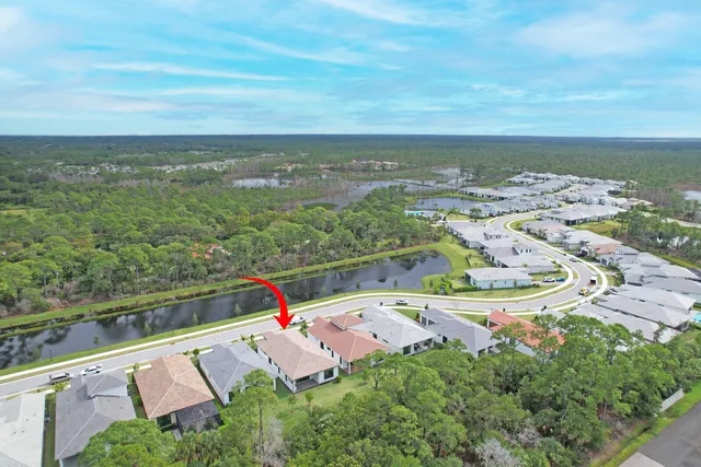 a view of a house with backyard porch and garden