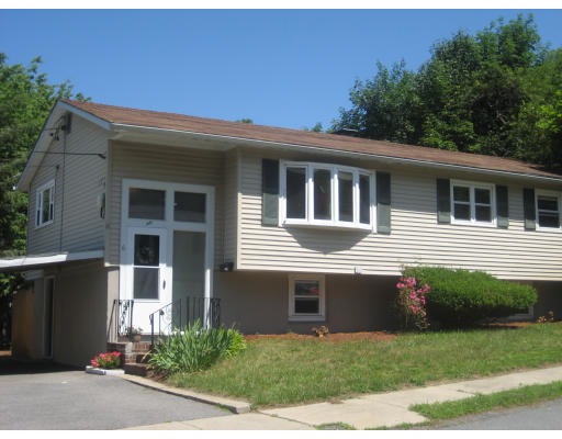 6 Belnap Road Boston, MA 02136 - Photo 1 of 14 a front view of a house with garage