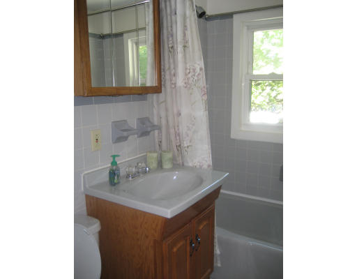 6 Belnap Road Boston, MA 02136 - Photo 11 of 14 a bathroom with a sink and a mirror