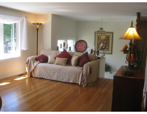 6 Belnap Road Boston, MA 02136 - Photo 6 of 14 a bedroom with a bed and a chandelier