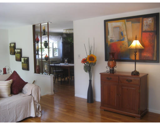 6 Belnap Road Boston, MA 02136 - Photo 8 of 14 a living room with furniture a chandelier and a large window