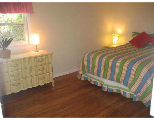 6 Belnap Road Boston, MA 02136 - Photo 10 of 14 a bedroom with a bed and window