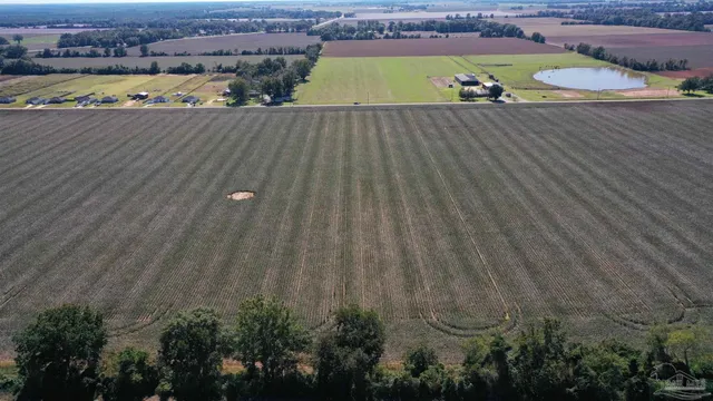 an aerial view of a house with a ocean view