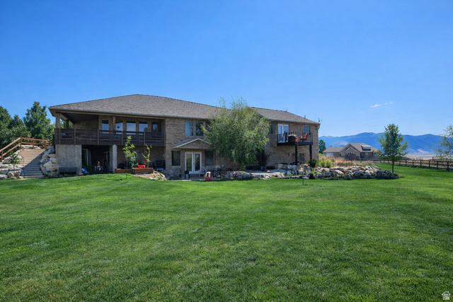 3054 West Ridgeline Road Stockton, UT 84071 - Photo 5 of 88 Rear view of property featuring a patio area, a balcony, and a mountain view